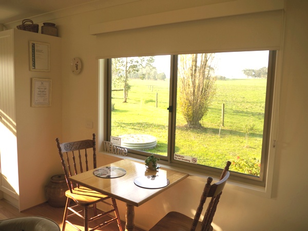 Dining area with views of farmland at Little Lake Cottage Nyora